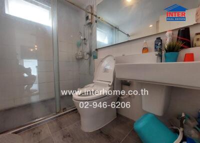 Bathroom with standing shower and modern fixtures