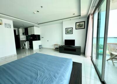 Bedroom with balcony and ocean view