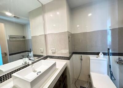 Modern bathroom with large mirror and sink