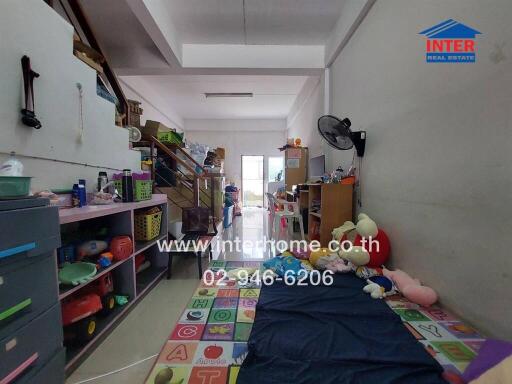 Kids bedroom with toys, bunk bed, and colorful playmat