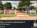vacant land for sale with gate and 'for sale' sign