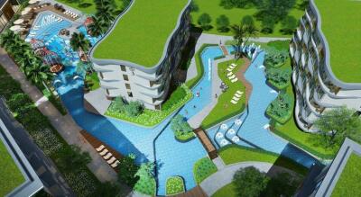 Aerial view of modern apartment complex with pools and green rooftops