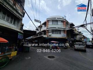 Street view of a corner building in an urban area