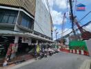 Apartment building exterior with nearby street and construction site