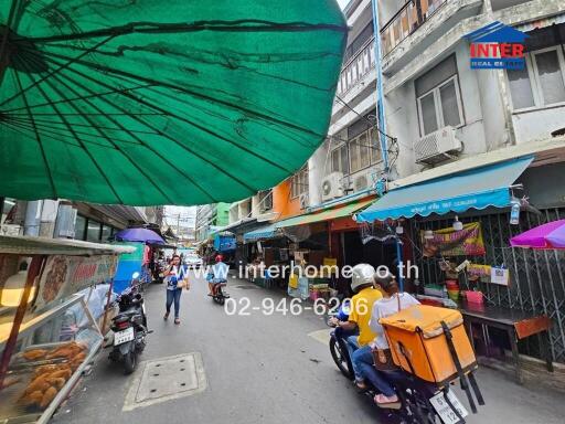 Street view with shops and pedestrians