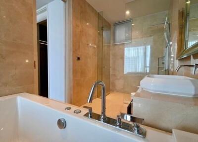 Modern bathroom with bathtub, shower, and sink