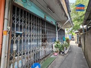 Exterior view of a building with metal gate