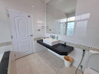 Modern bathroom with large mirror and sink