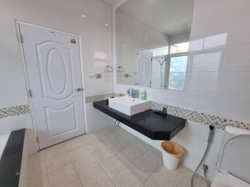 Modern bathroom with large mirror and sink