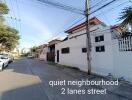 A quiet neighborhood with two-lane street view