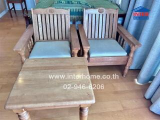 Living room with wooden chairs and table