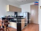 Modern kitchen space with wooden furniture and appliances.