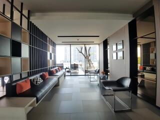 Modern living room with large windows and city view