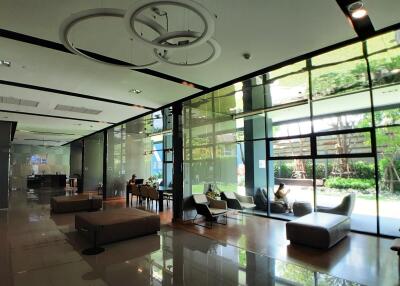 Spacious and modern lobby area with seating and large windows