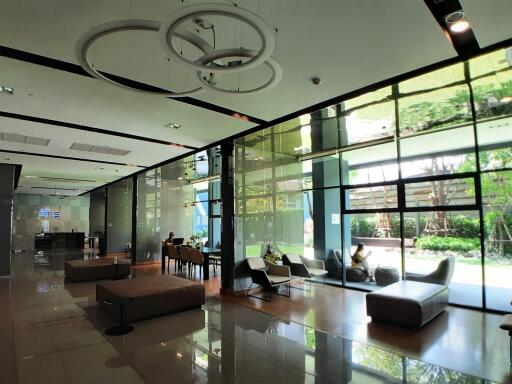 Spacious and modern lobby area with seating and large windows