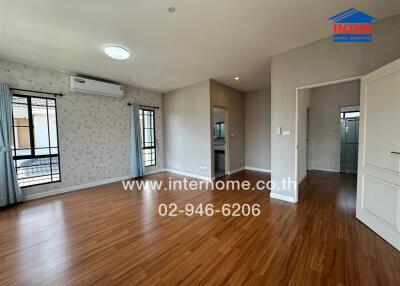 Living room with wooden flooring and air conditioning