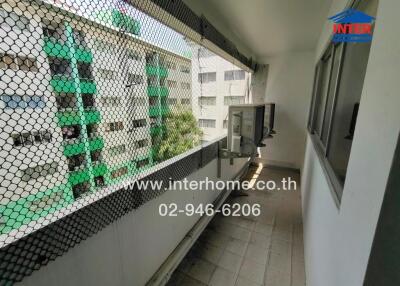 Spacious balcony with safety net and outdoor water heater