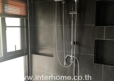 Bathroom with modern shower and window