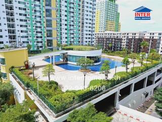 Aerial view of a condominium building with a rooftop garden and swimming pool.