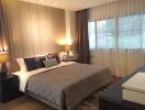 Well-furnished bedroom with double bed and bedside tables