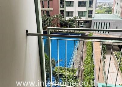 Balcony with pool view in apartment complex