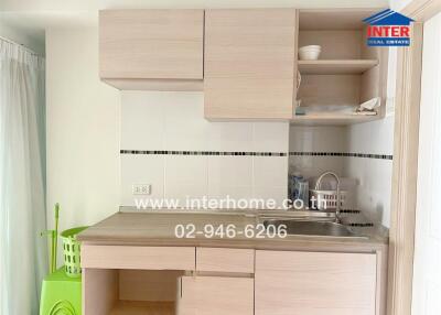 Modern small kitchen with wooden cabinets and integrated sink