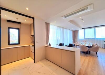 Modern kitchen and dining area with natural light