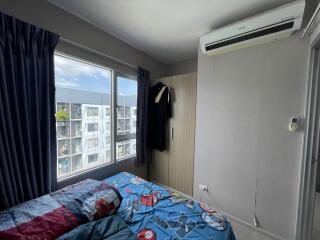 Cozy bedroom with window view and air conditioning