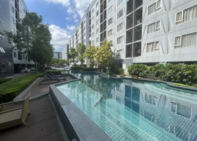Outdoor pool area of a modern apartment complex