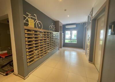 Building lobby area with mailboxes and bicycles decoration