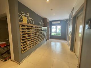 Building lobby area with mailboxes and bicycles decoration