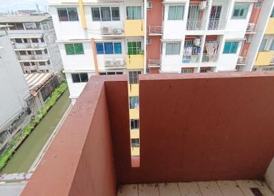 View from balcony overlooking buildings and canal