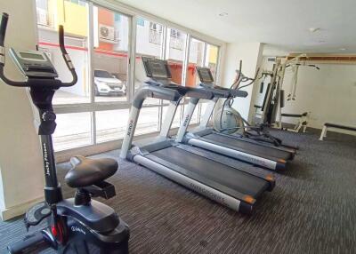 A fitness center with exercise equipment such as treadmills and a stationary bike