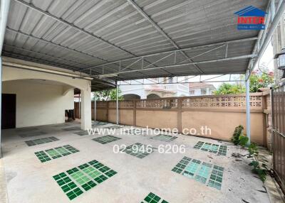 Covered patio area with tiled floor