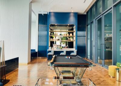Modern recreational room with pool table and bar shelves