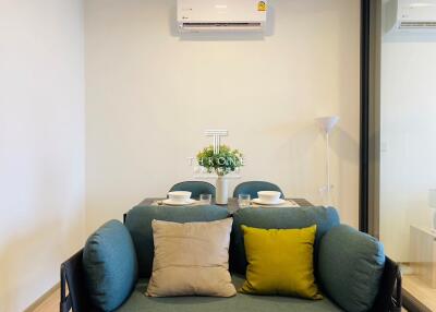 Dining area with a small table and air conditioning