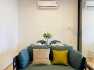 Dining area with a small table and air conditioning