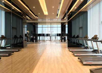 Well-equipped indoor gym with treadmills and modern lighting
