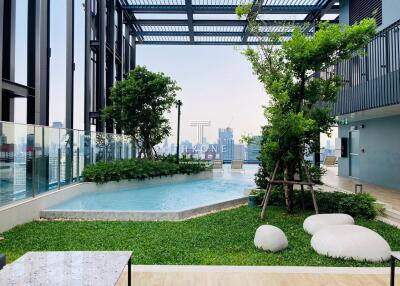 Rooftop garden with swimming pool and city skyline view