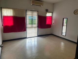 Living room with large windows and curtains