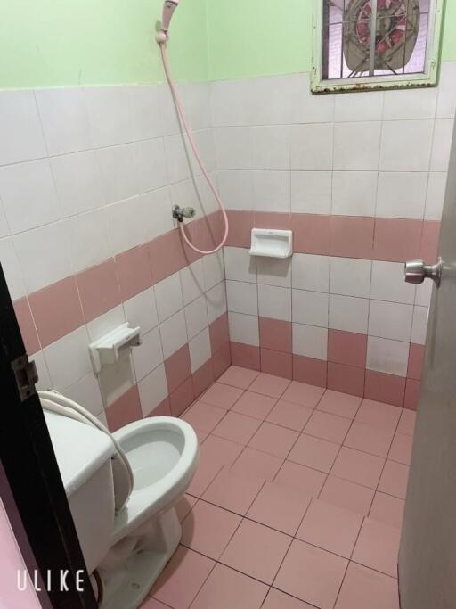 Small bathroom with pink tiles