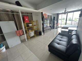 living and dining area with open storage and outdoor view