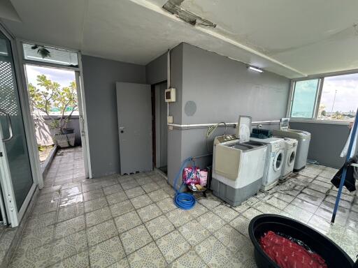 Laundry area with washing machines and utility sink