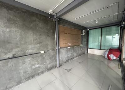 Unfurnished room with tiled floor and large windows