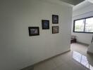 Hallway with framed pictures on the wall