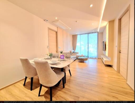 Modern living and dining area with wooden flooring and plenty of natural light