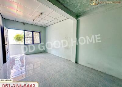 Bright empty bedroom with tiled floor and large window