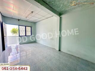 Bright empty bedroom with tiled floor and large window