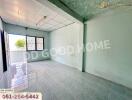 Bright empty bedroom with tiled floor and large window