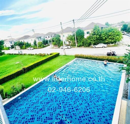 Private swimming pool overlooking residential area